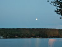 Watching the moon across the lake from our vacation home.